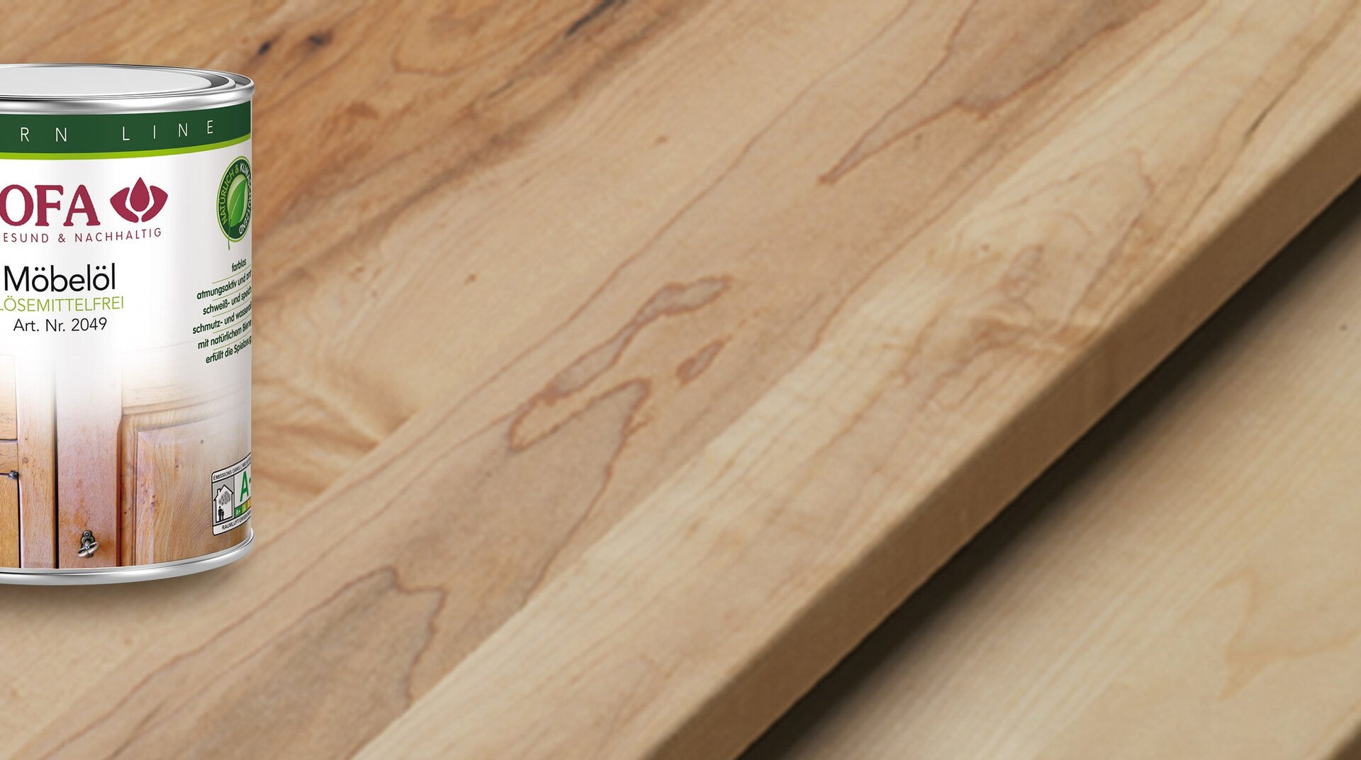 BIOFA Naturprodukte Möbelöl, in Dose, vor Holzbrettern