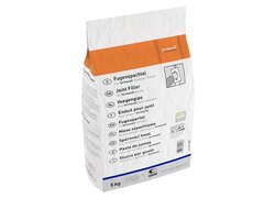 Spachtel, Putz Mörtel, verpackt in weißes Papier